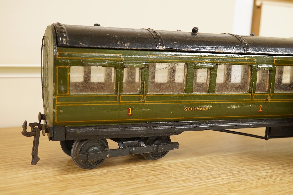 Four 0 gauge 1930s wooden Bonds bogie coaches; three Southern Railway; a Composite Brake, and two First Third Composites, and an LMS First Third Composite